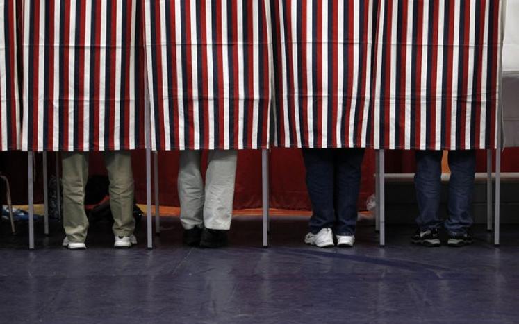 Red, white, and blue voting booths